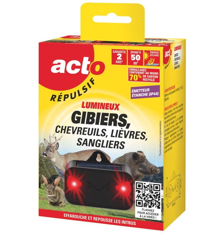 Répulsif gibier solaire lumineux fixé sur un piquet en bois dans un jardin.